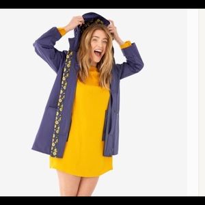 Shoshonna raincoat and mashing unbrella.